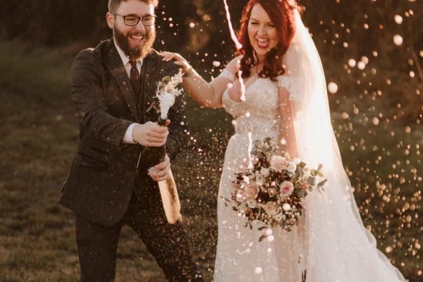 Rosie and Martin pop champaign