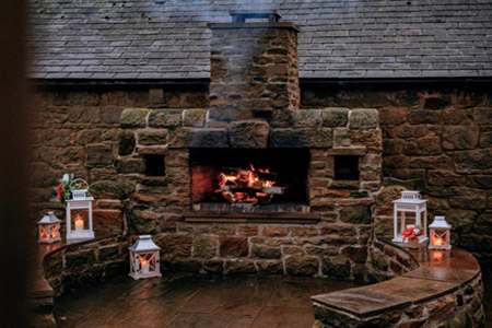 Lanterns and fireplace in the Courtyard