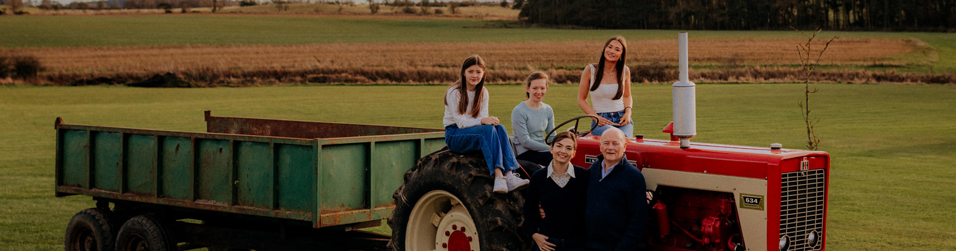 Lockey family pose with a classic tractor