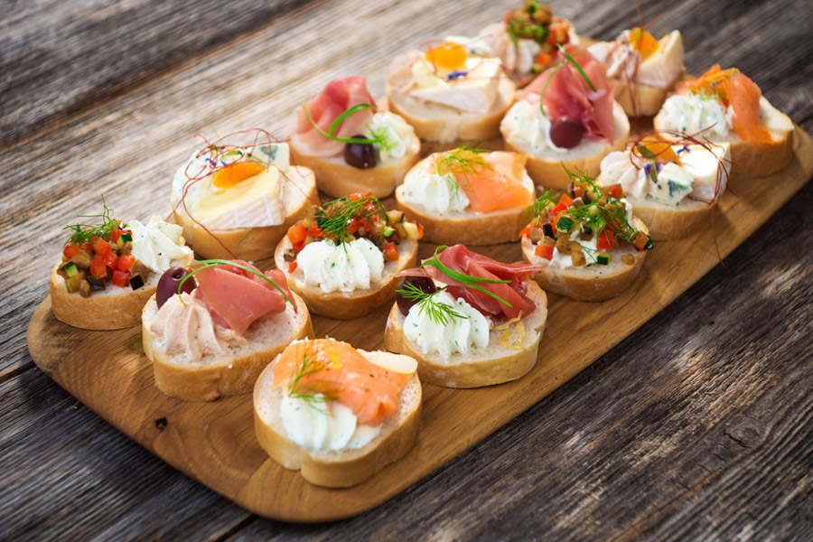 Canapes on a wooden platter