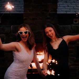 Two happy girls with sparklers