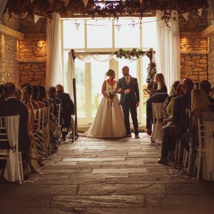 Couple getting married in the Barn
