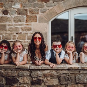 Amy & Stephen with children wearing heart sunglasses