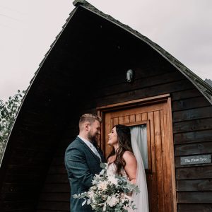 Jessica & Alex outside a glamping pod