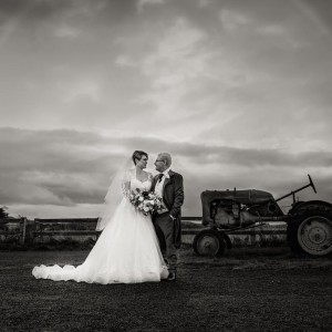 Ross - Couple in bw with tractor and sun halo
